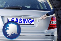 alaska map icon and silver car with LEASING painted in blue