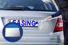 north-dakota map icon and silver car with LEASING painted in blue