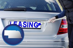 nebraska map icon and silver car with LEASING painted in blue