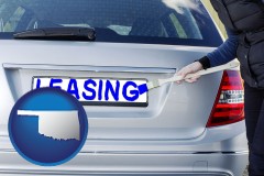 oklahoma map icon and silver car with LEASING painted in blue