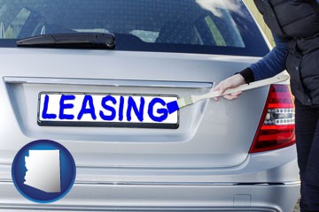 silver car with LEASING painted in blue - with Arizona icon