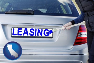 silver car with LEASING painted in blue - with California icon