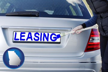 silver car with LEASING painted in blue - with Georgia icon