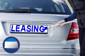 silver car with LEASING painted in blue - with Kansas icon