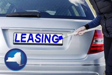 silver car with LEASING painted in blue - with New York icon