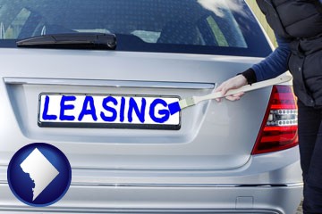 silver car with LEASING painted in blue - with Washington, DC icon