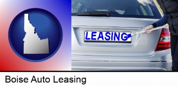 silver car with LEASING painted in blue in Boise, ID