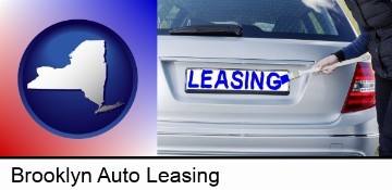 silver car with LEASING painted in blue in Brooklyn, NY