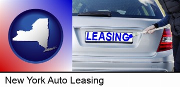 silver car with LEASING painted in blue in New York, NY