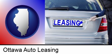 silver car with LEASING painted in blue in Ottawa, IL
