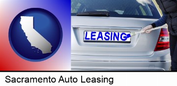 silver car with LEASING painted in blue in Sacramento, CA