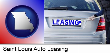 silver car with LEASING painted in blue in Saint Louis, MO